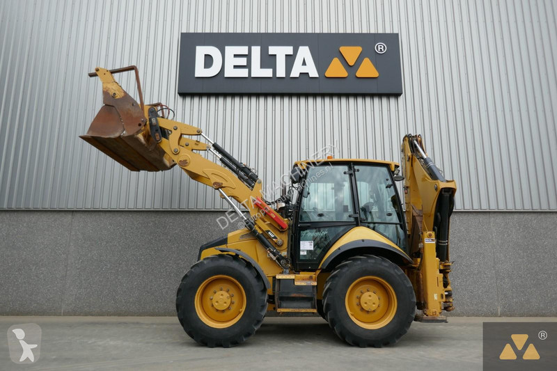 Traktor med grab Caterpillar 444F