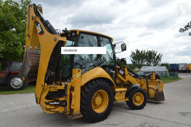 Traktor med grab Caterpillar