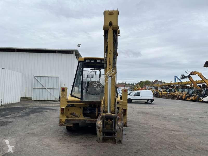 Traktor med grab Caterpillar