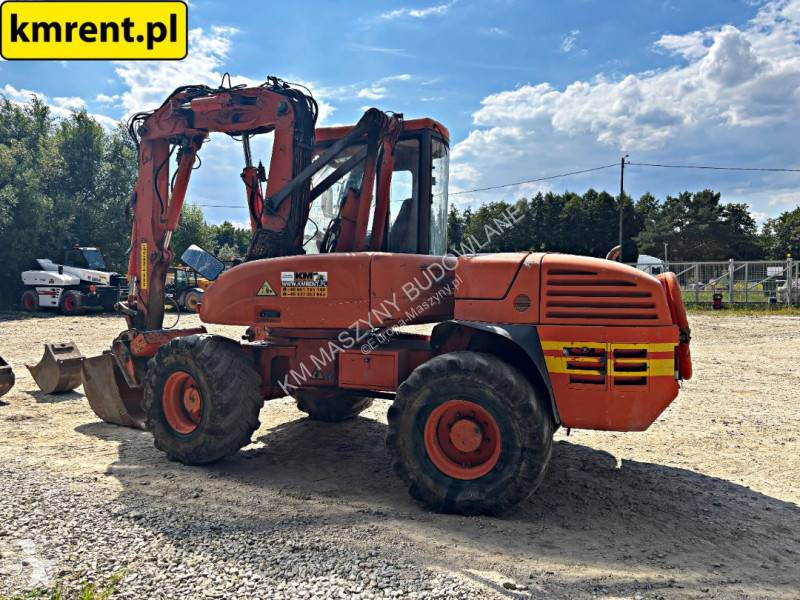 Traktor med grab Mecalac 12 MTX...