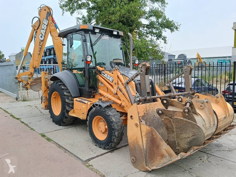 Traktor med grab Case backhoe loader graaf laad...