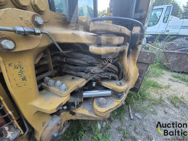 Екскаватор навантажувач Caterpillar