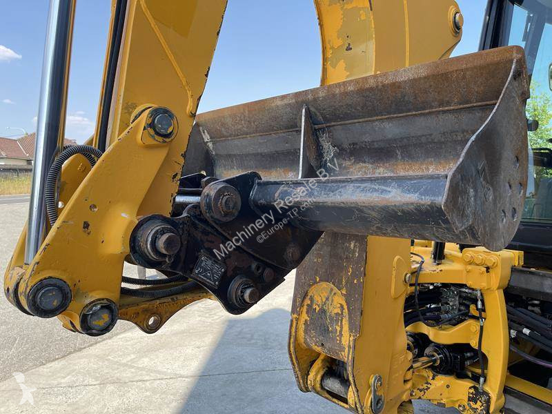 Traktor med grab Caterpillar