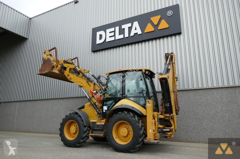 Traktor med grab Caterpillar 444F