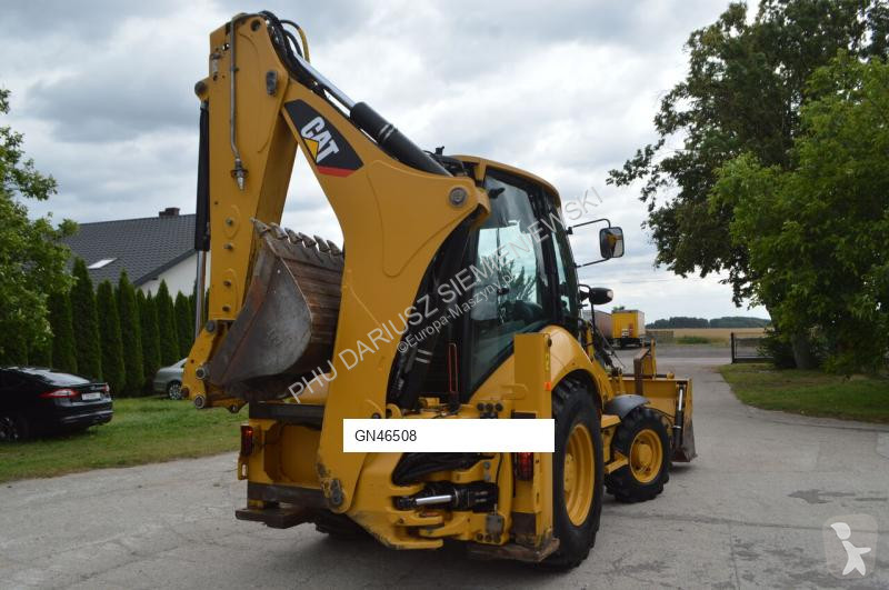 Traktor med grab Caterpillar