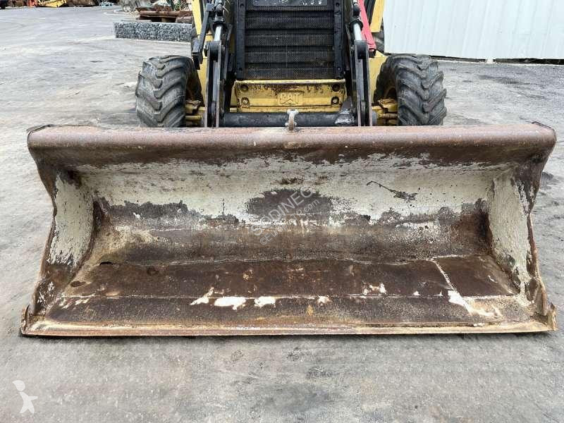 Traktor med grab Caterpillar