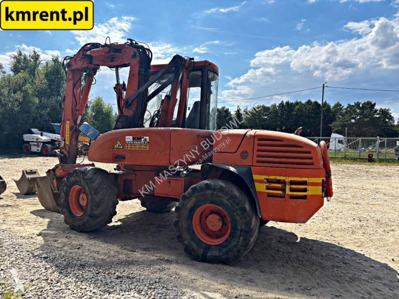 Traktor med grab Mecalac 12 MTX...