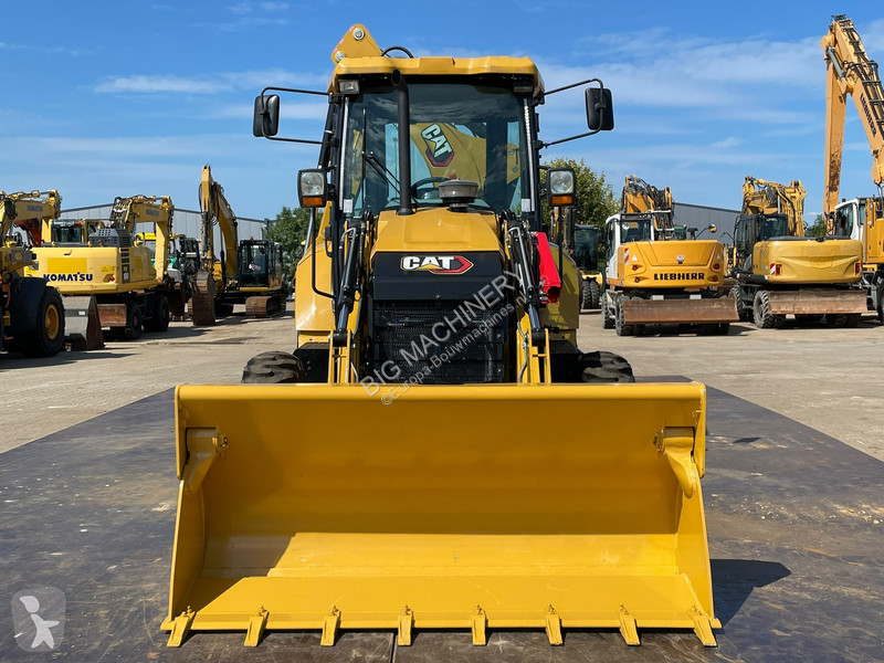 Traktor med grab Caterpillar 424