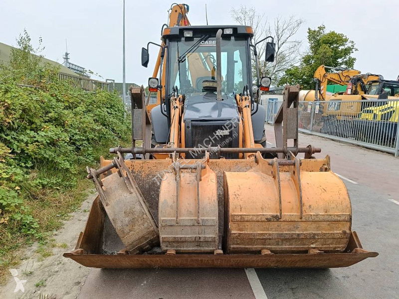 Traktor med grab Case backhoe loader graaf laad...
