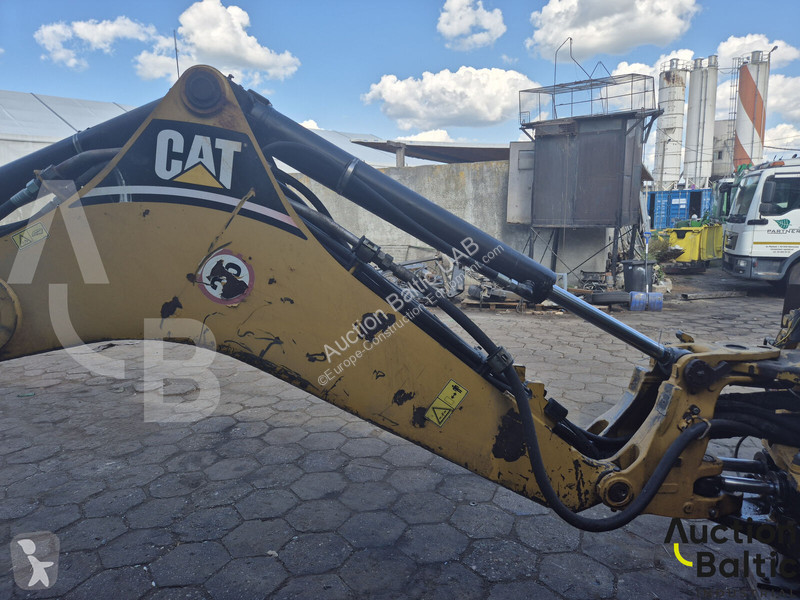 Екскаватор навантажувач Caterpillar