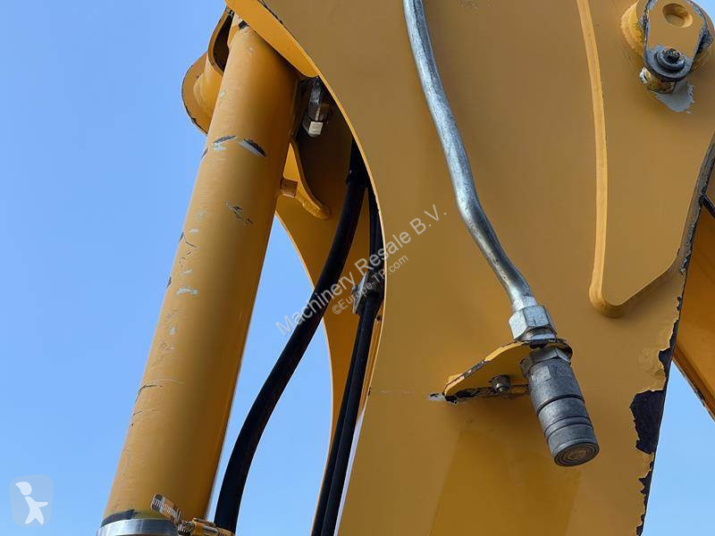 Traktor med grab Caterpillar
