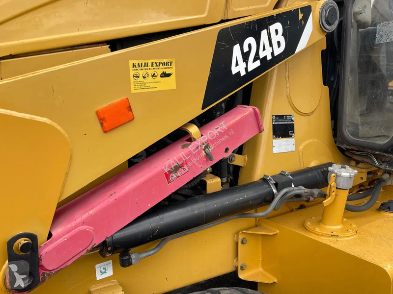Traktor med grab Caterpillar 424B Backhoe...