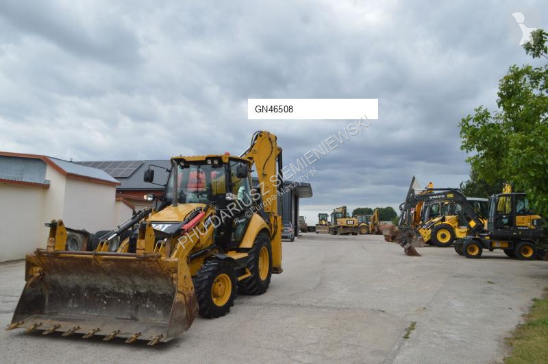 Traktor med grab Caterpillar