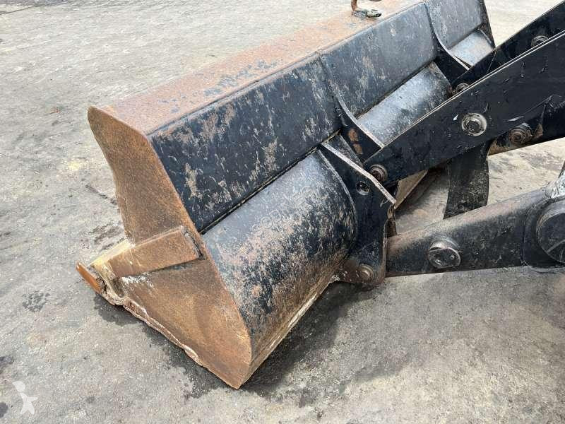 Traktor med grab Caterpillar