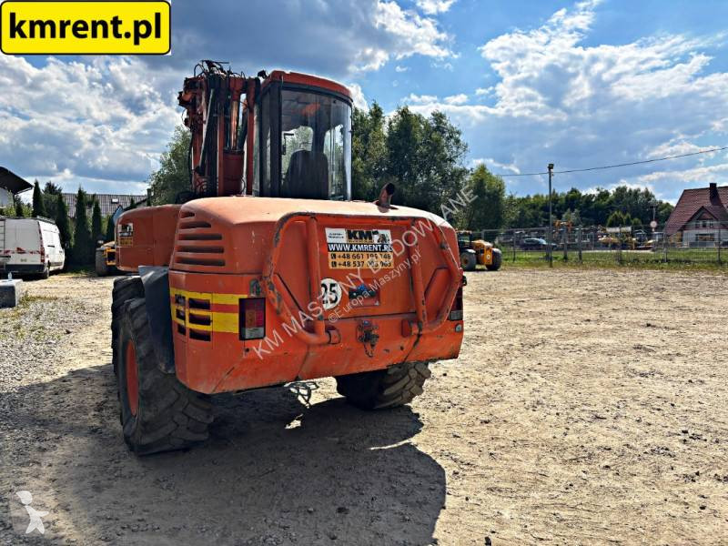 Traktor med grab Mecalac 12 MTX...