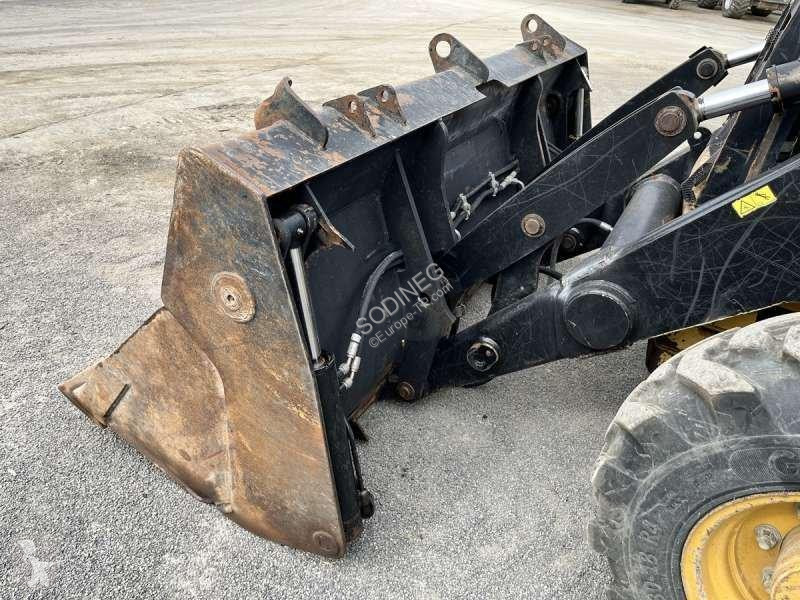Traktor med grab Caterpillar