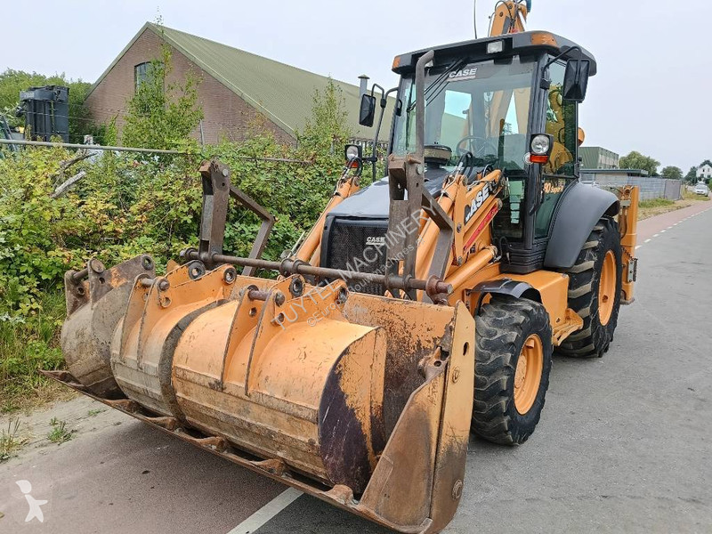 Traktor med grab Case backhoe loader graaf laad...