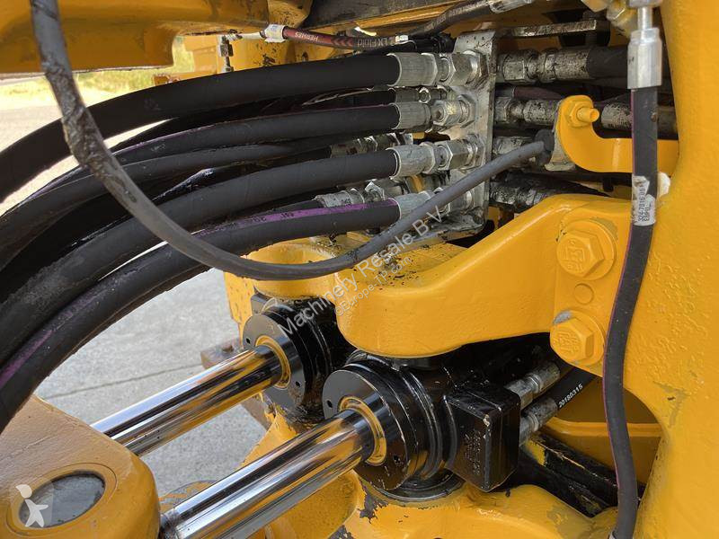 Traktor med grab Caterpillar