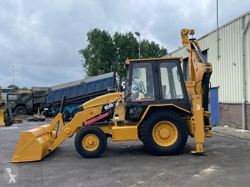 Traktor med grab Caterpillar 424B Backhoe...