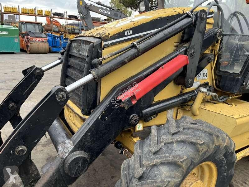 Traktor med grab Caterpillar