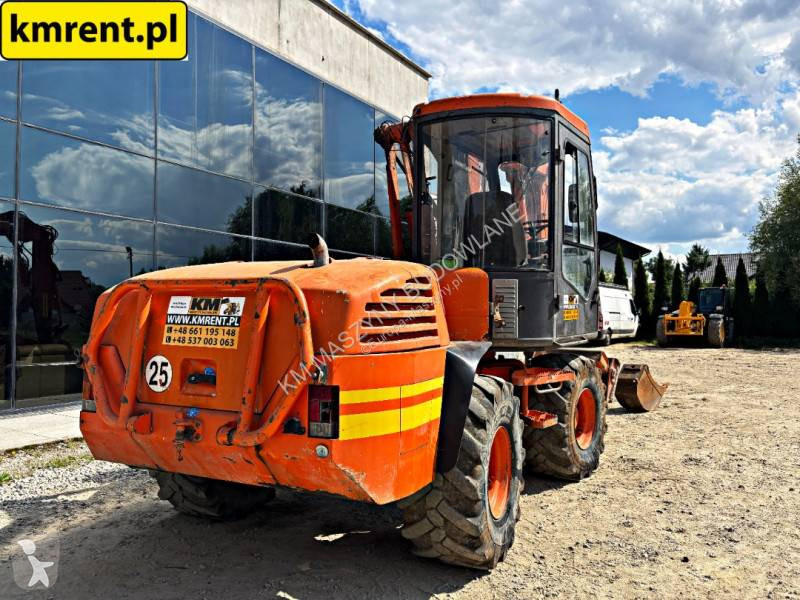 Traktor med grab Mecalac 12 MTX...