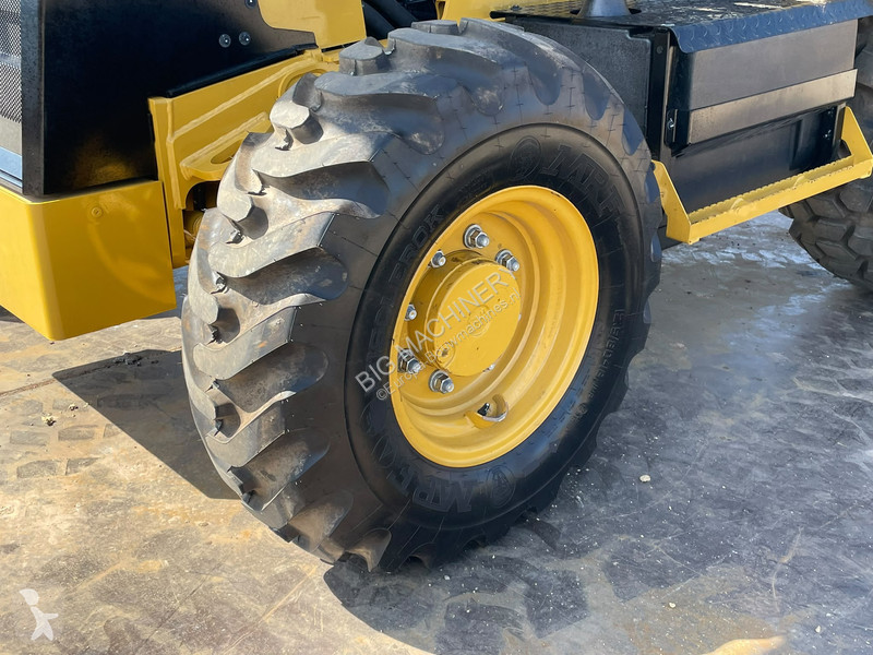 Traktor med grab Caterpillar 424