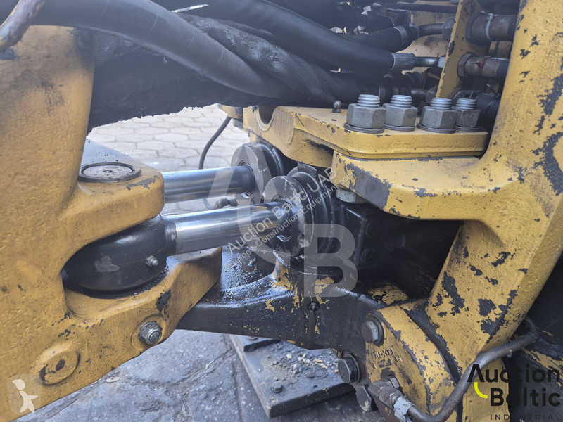 Екскаватор навантажувач Caterpillar