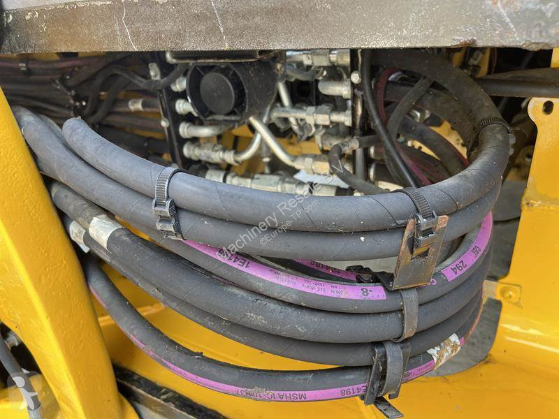 Traktor med grab Caterpillar