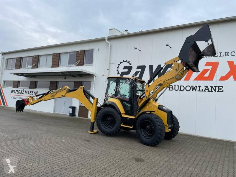 Traktor med grab Caterpillar 444 F2