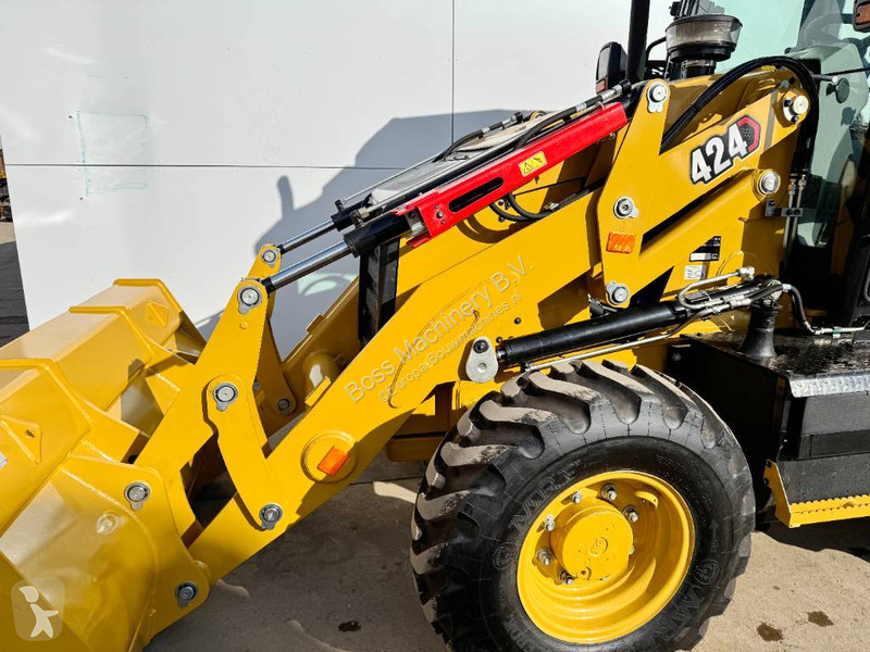 Traktor med grab Caterpillar 424 4WD - Hammer...