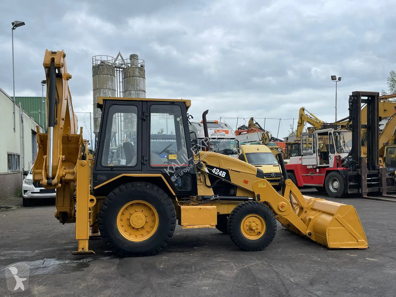 Traktor med grab Caterpillar 424B Backhoe...
