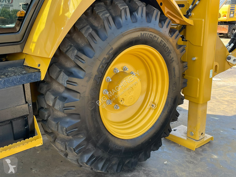 Traktor med grab Caterpillar 424