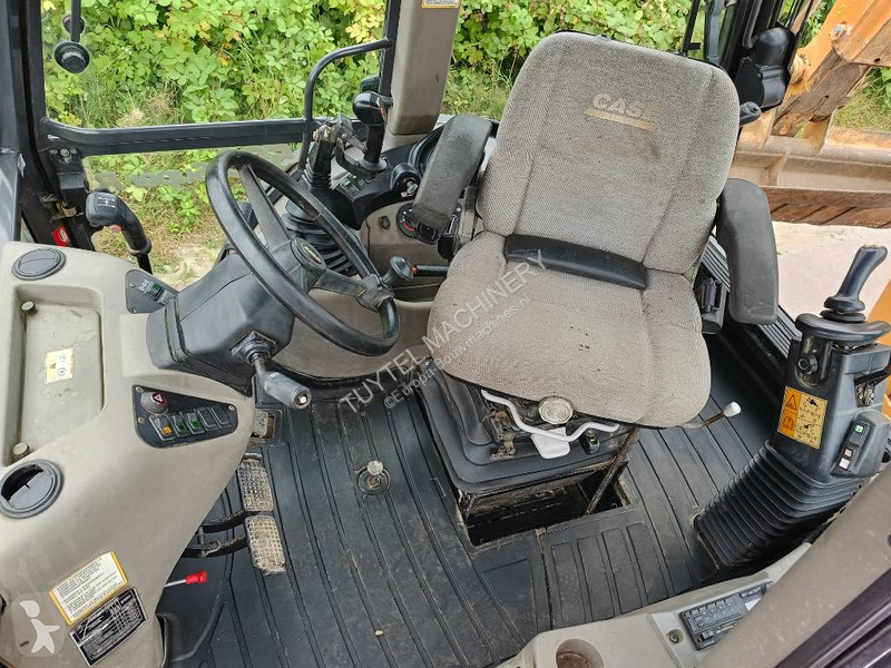Traktor med grab Case backhoe loader graaf laad...