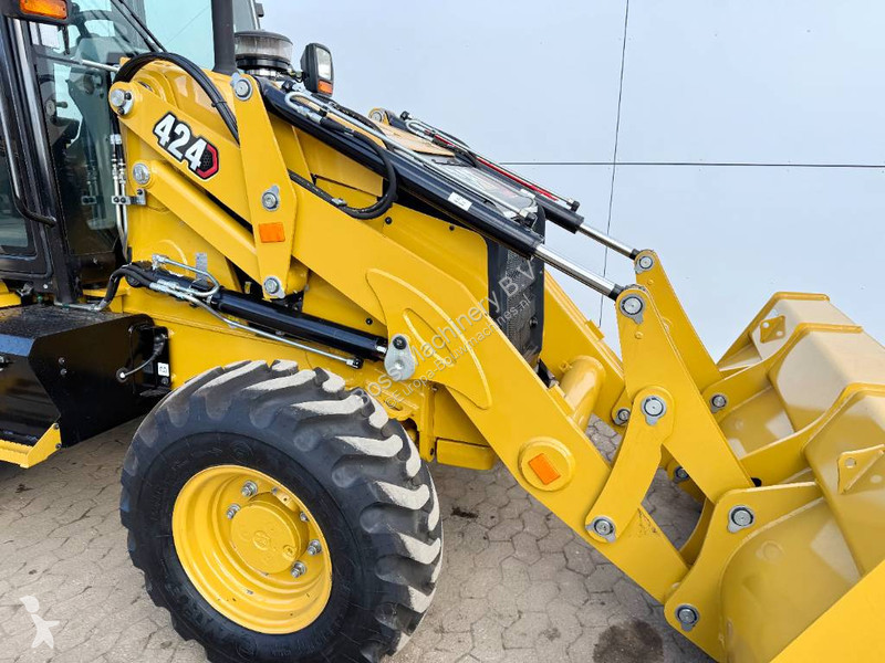 Traktor med grab Caterpillar 424 4WD - Hammer...