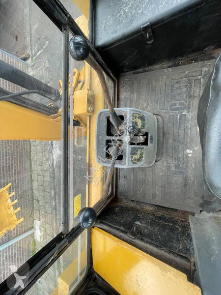 Traktor med grab Caterpillar 424B Backhoe...