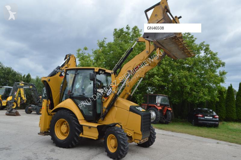 Traktor med grab Caterpillar