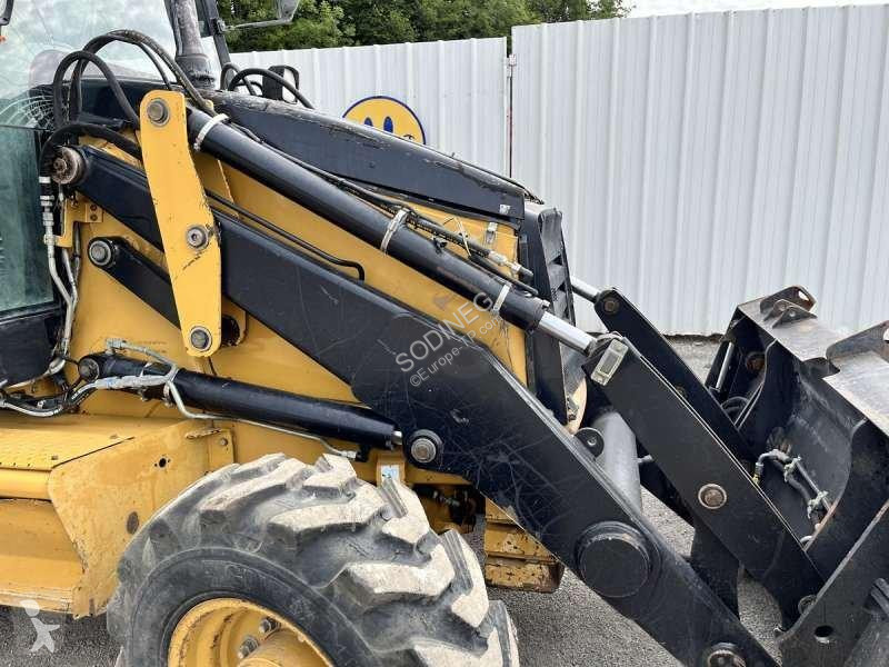 Traktor med grab Caterpillar