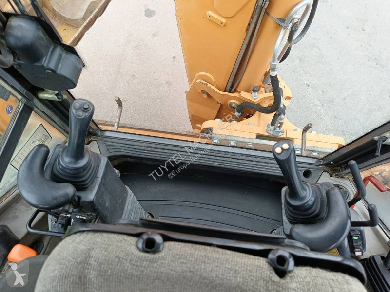 Traktor med grab Case backhoe loader graaf laad...