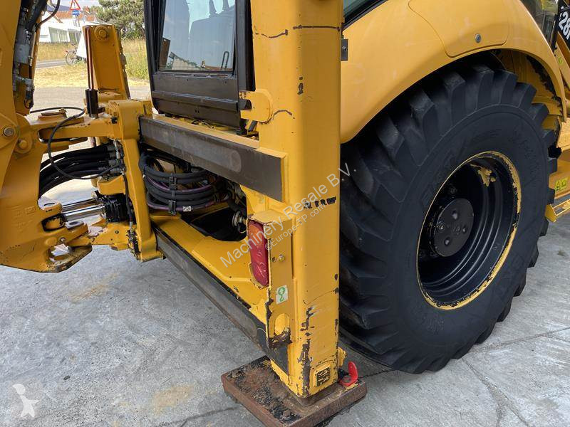 Traktor med grab Caterpillar