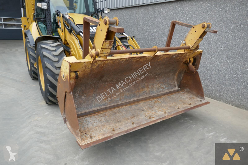 Traktor med grab Caterpillar 444F