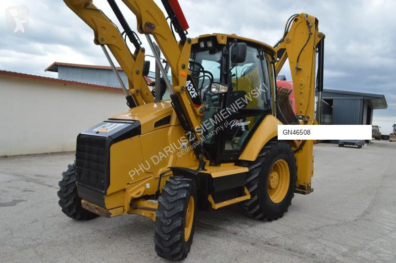 Traktor med grab Caterpillar