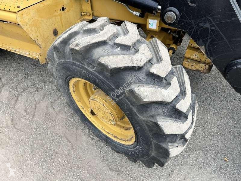 Traktor med grab Caterpillar