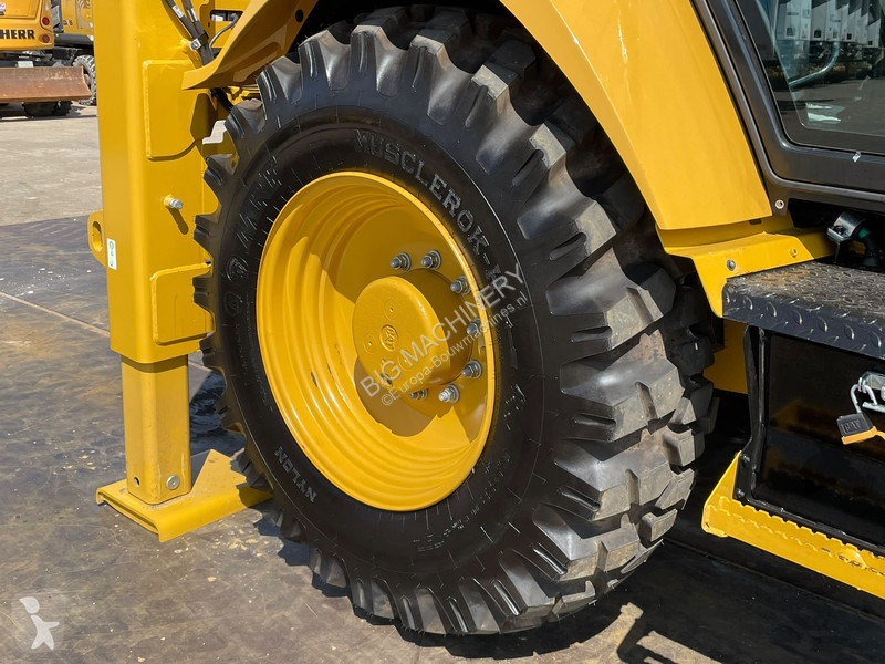 Traktor med grab Caterpillar 424