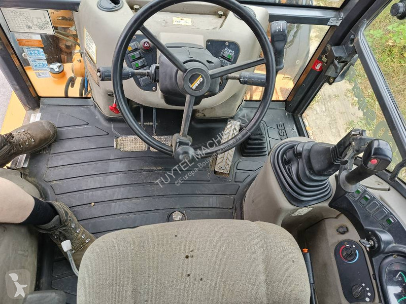 Traktor med grab Case backhoe loader graaf laad...