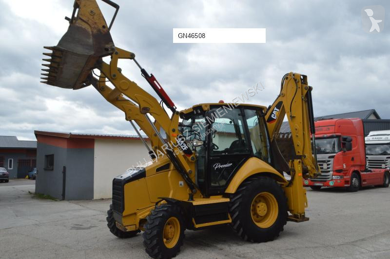 Traktor med grab Caterpillar