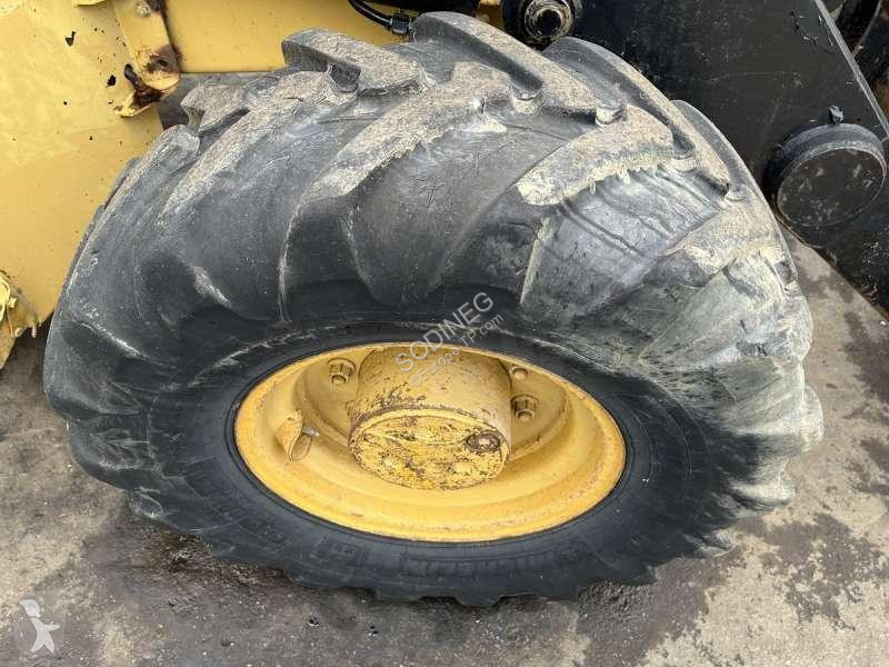 Traktor med grab Caterpillar