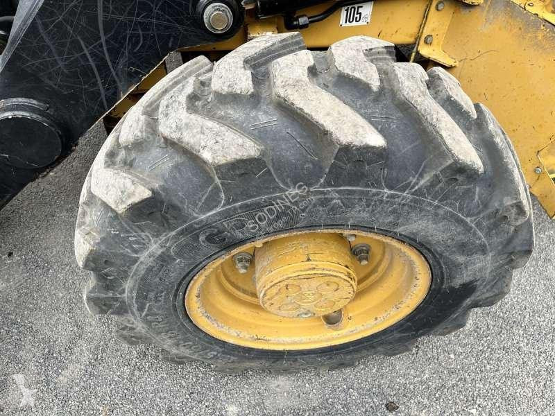 Traktor med grab Caterpillar