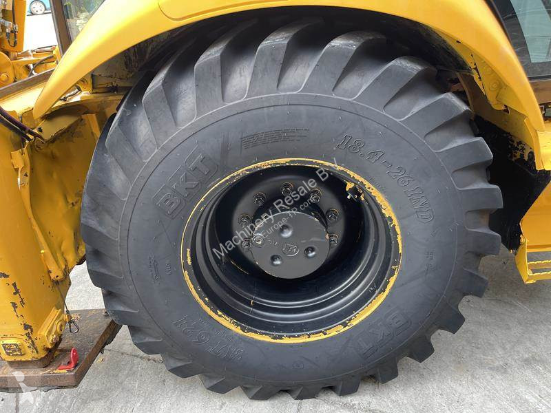 Traktor med grab Caterpillar
