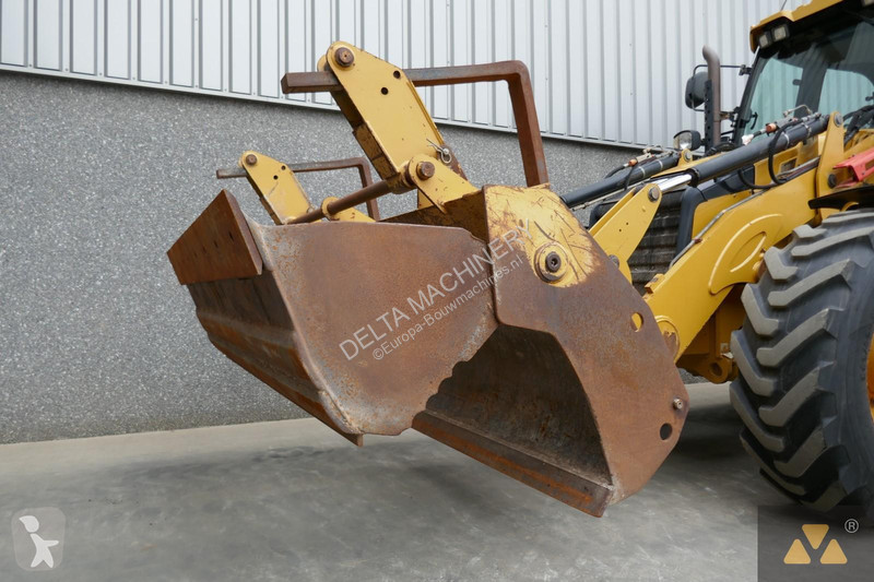 Traktor med grab Caterpillar 444F