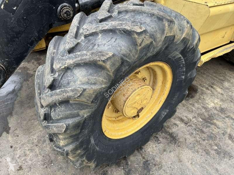 Traktor med grab Caterpillar